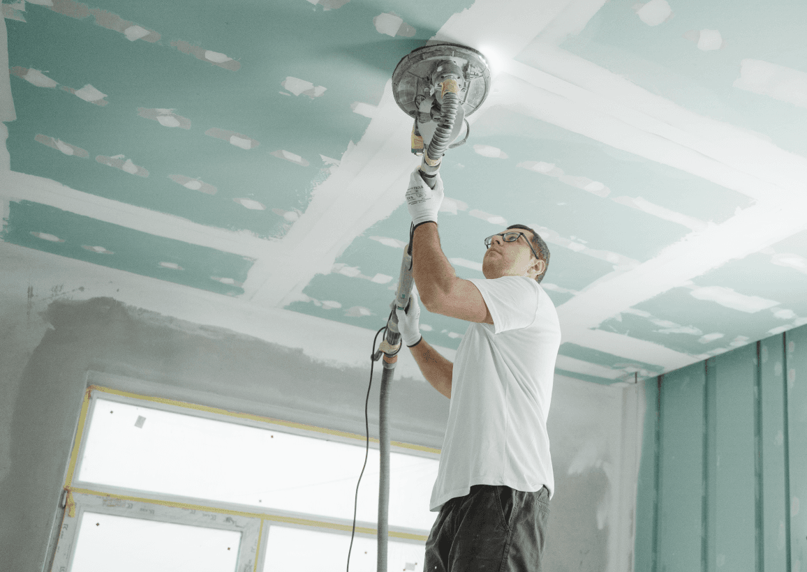 man installing insulation